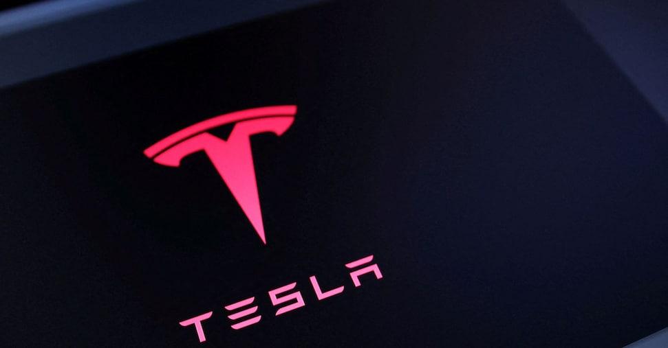 Tesla beats expectations with record revenue of $28.1 billion, but profits fall ...
